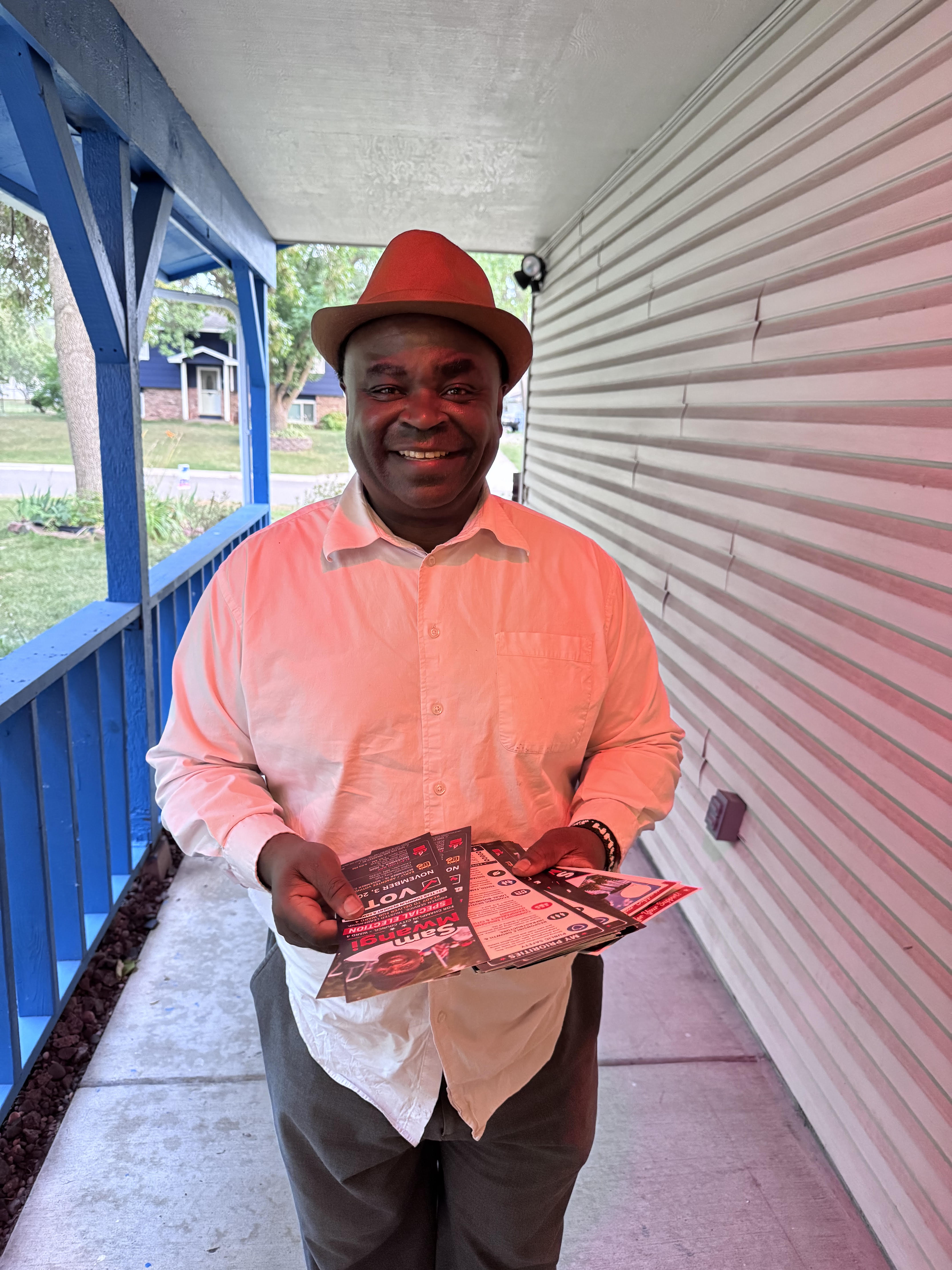 Sam Mwangi meeting residents and sharing campaign information